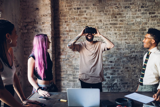 Creative Team Using Vr Goggles In Loft Office