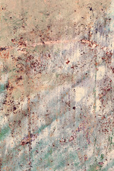 Creative background of rusty metal, painted gray paint carelessly with the remnants of torn paper. Grungy metal surface. Great background or texture for your project.