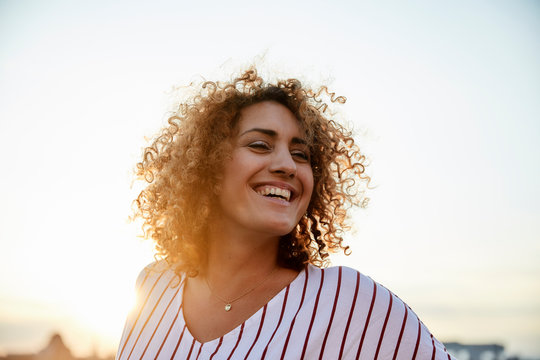 Portrait of smiling woman in the evening light