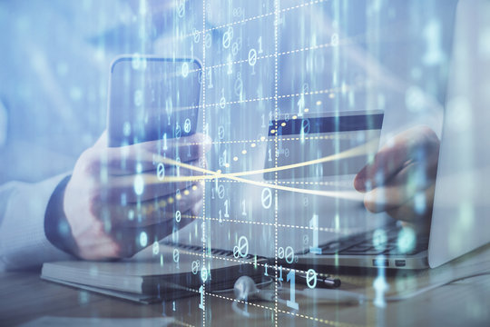 Double exposure of man hands holding a credit card and data theme drawing. E-commerce and technology concept.