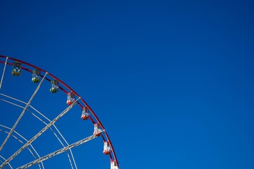 ferris wheel against blue sky