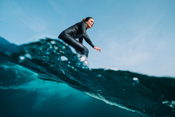 Low angle view of woman surfing in sea