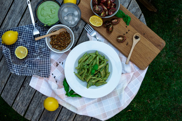 Italian penne pesto meal for one outdoors
