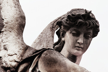 Death. AQngel as symbol of pain, fear and end of life. Ancient statue, fragment.