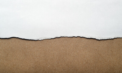 White paper with torn edges, wrapping gray paper inside. Background for text.
