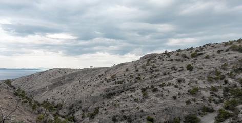Cliffs surrounding the Pustinja Blaca, deserted remote area on the island of Brac in Croatia