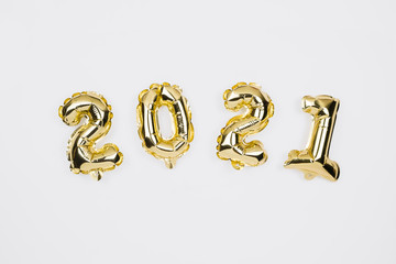  Happy New year 2021 celebration. Gold foil balloons numeral 2020 on white background