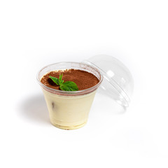 Classic tiramisu in a glass on a white background