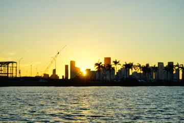 Miami downtown skyscrapers and beach at sun set