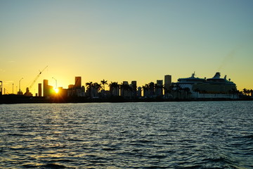 Miami downtown skyscrapers and beach at sun set