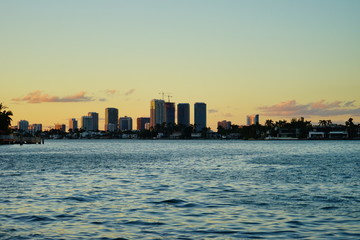 Fototapeta na wymiar Miami downtown skyscrapers and beach at sun set