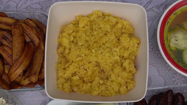 cassava, fried plantain and cheese on a table viewed from above. various typical dishes of the Peruvian rainforest