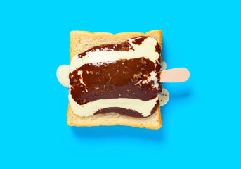 chocolate with peanut flavor popsicle melting on slice of bread