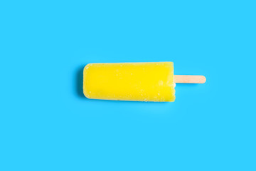 top view fresh yellow popsicle on blue background