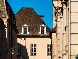 Beautiful ancient architecture of Burgundy. Streets of the city of Beaune. Sunny spring day. Advertising tourist types.