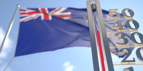 Thermometer shows high air temperature against blurred flag of New Zealand. Hot weather forecast related 3D rendering