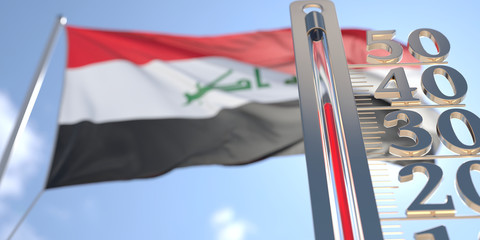 Thermometer shows high air temperature against blurred flag of Iraq. Hot weather forecast related 3D rendering