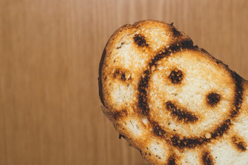 Toasted bread with smiling sun picture