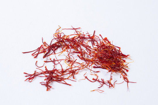 Delicious saffron cultivated on white background