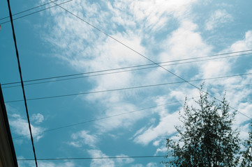 Wires crossing the blue sky. cable connections