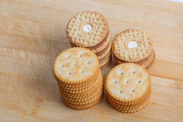 Cream sandwich biscuits on the wooden board
