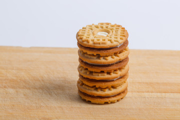 Cream sandwich biscuits on the wooden board
