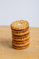 Cream sandwich biscuits on the wooden board
