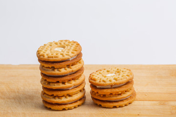 Cream sandwich biscuits on the wooden board
