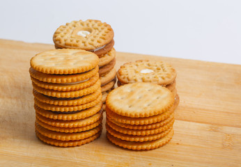 Cream sandwich biscuits on the wooden board
