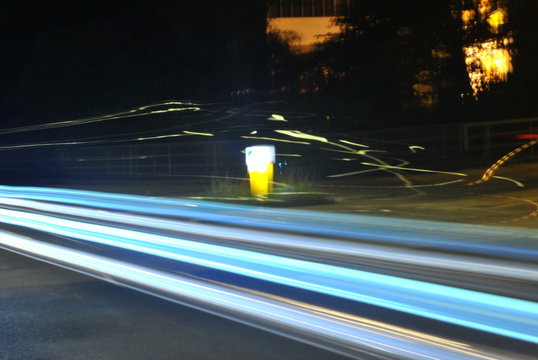 Long Exposure Shot Of A Car On The Road At Night