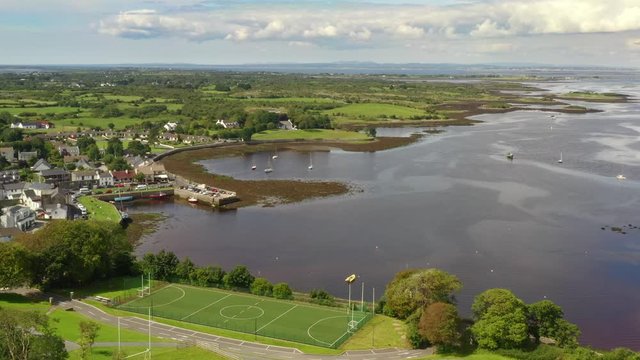 Kinvara, Galway, Ireland, August 2020, Drone slowly descending while pushing towards fishing village.