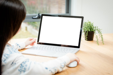 Fototapeta premium Child Uses a Computer for School Work