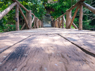 Wooden path and waterfall in the park