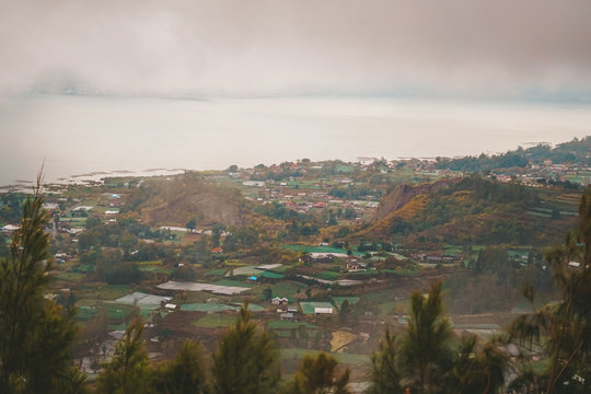 Kintamani is a village on the western edge of the larger caldera wall of the Mount Batur (Gunung Batur) caldera in Bali, Indonesia. It is on the same north&ndash;south road as Penelokan and has been used as