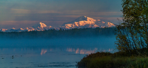 Denali and Mt Hunter reflected in Kashwitna Lake, south of Talkeetna, Alaska.