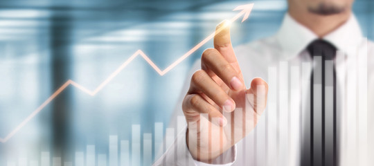 Businessman plan graph growth increase of chart positive indicators in his business