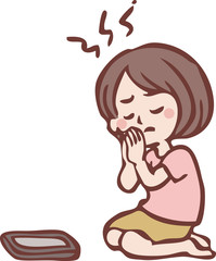 当選をスマートフォンに願う女性