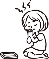 当選をスマートフォンに願う女性