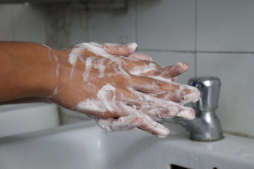 Fototapeta premium washing hands with soap sanitizer. wash movement