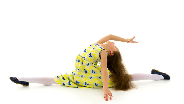 Girl Wearing Yellow Summer Dress and Shoes Sitting on Twine