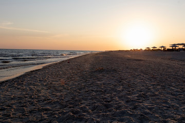 Beautiful orange sunset by the sea, summer beach day. Beautiful nature.