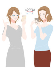 スマホでアドレスを交換する女性たち