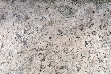 Travertine, a fragment of an old gray wall in stains and drawings
