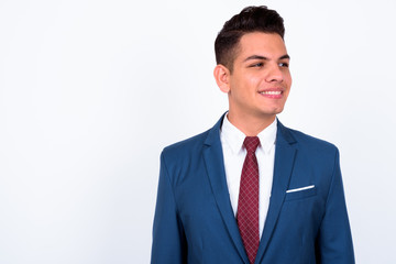 Portrait of happy young handsome multi ethnic businessman in suit