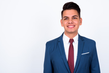 Portrait of happy young handsome multi ethnic businessman in suit