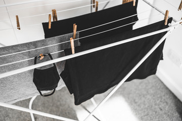 the new normal after the covid-19 pandemic, reusable fabric face mask just washed and hung to dry...
