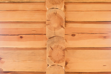 Fragment of a timber house under construction