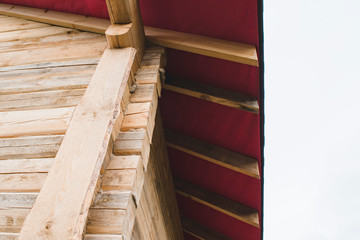 Fragment of a timber house under construction