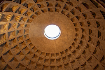 The Ancient Roman Pantheon in the heart of Rome, Italy features innovative ancient architecture including a circular domed ceiling an oculus 143 feet above the floor.