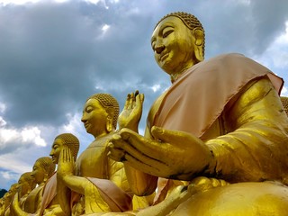 Many monks' statues make prayers in Makha Bucha Buddhist Memorial Park,Thailand